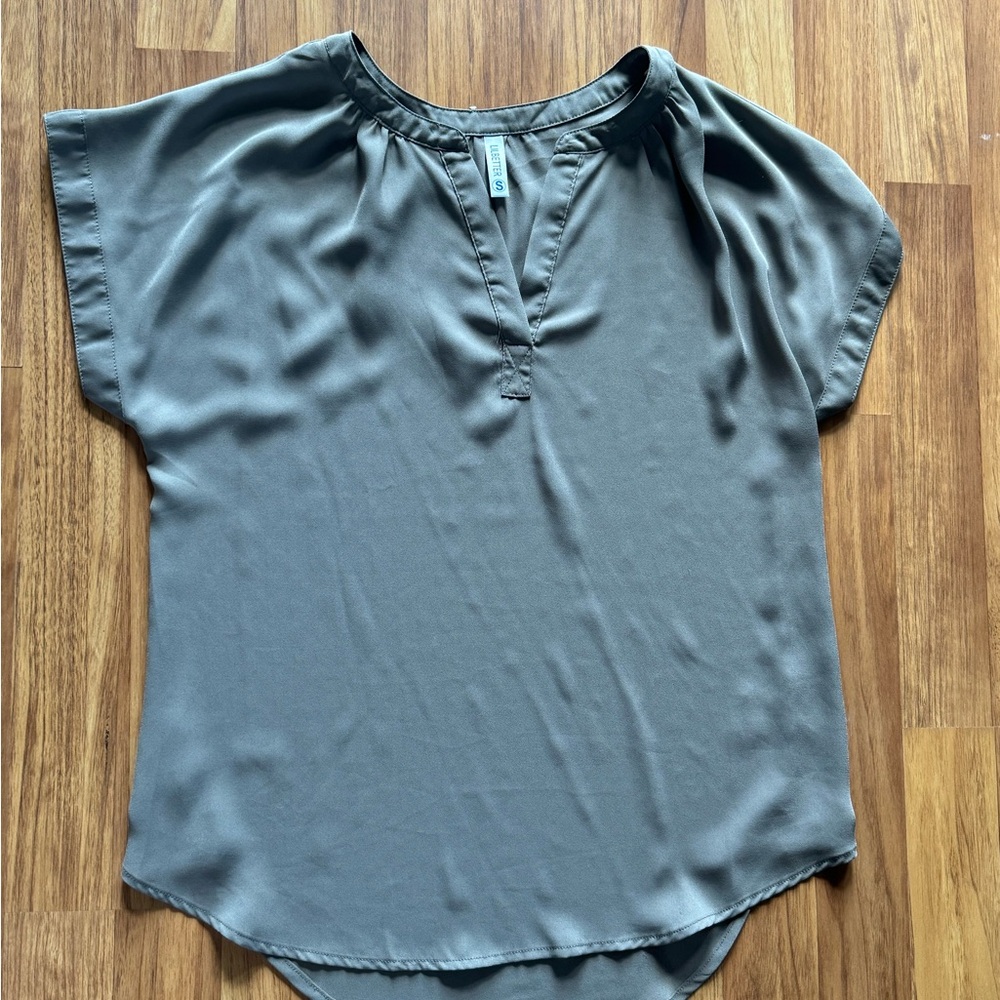 Gray work top with a peekaboo chest